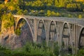 Famous bridge on the Tara river in Montenegro or Crna gora in evening sun, called ÃÂurÃâeviÃÂa. Colossal bridge spaning over Tara Royalty Free Stock Photo